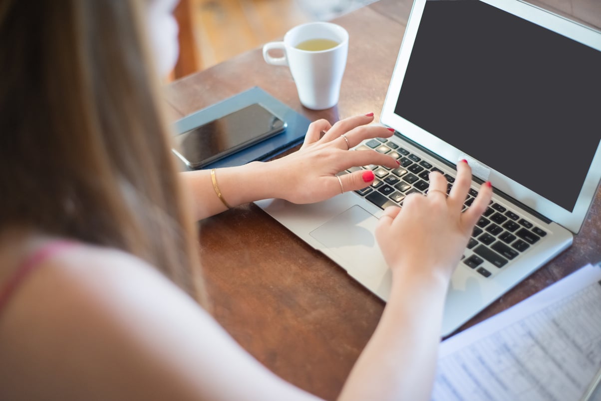 Person Typing on Computer Laptop